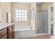 Main bathroom with soaking tub and glass enclosed shower at 1149 6Th Ave. S, North Myrtle Beach, SC 29582