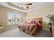Main bedroom with neutral colors, trey ceiling, and view of the lake at 1149 6Th Ave. S, North Myrtle Beach, SC 29582
