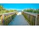 Boardwalk to the beach access with vegetation surrounding the pathway at 1207 S Ocean Blvd. # 50809, Myrtle Beach, SC 29577