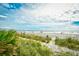 Scenic beach view showcasing sandy shore, swaying palms, and a refreshing ocean panorama at 1207 S Ocean Blvd. # 50809, Myrtle Beach, SC 29577