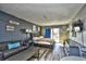 Cozy condo bedroom with queen bed, small sofa and balcony access at 1207 S Ocean Blvd. # 50809, Myrtle Beach, SC 29577
