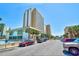 Exterior view of the condos with parking, landscaping and clear blue sky at 1207 S Ocean Blvd. # 50809, Myrtle Beach, SC 29577