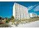 Towering condo building with multiple balconies offering stunning views at 1207 S Ocean Blvd. # 50809, Myrtle Beach, SC 29577