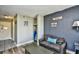 Living room view with sofa, closet area, and door to the hallway at 1207 S Ocean Blvd. # 50809, Myrtle Beach, SC 29577