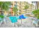 Relaxing outdoor pool area surrounded by palm trees and building's balconies at 1207 S Ocean Blvd. # 50809, Myrtle Beach, SC 29577