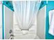 Clean shower area with a white shower curtain and chrome fixtures for a refreshing experience at 1207 S Ocean Blvd. # 50809, Myrtle Beach, SC 29577
