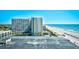 Aerial view shows beachside resort, ocean, and the nearby coastline, emphasizing its prime location at 1207 S Ocean Blvd. # 51012, Myrtle Beach, SC 29577