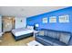 Cozy bedroom with bed, sofa, accent wall art, and ample natural light at 1207 S Ocean Blvd. # 51012, Myrtle Beach, SC 29577