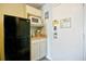 Functional kitchenette area with essential appliances and neat white cabinetry at 1207 S Ocean Blvd. # 51012, Myrtle Beach, SC 29577