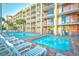 Outdoor pools with lounge chairs showcasing a resort-style amenity for relaxation and recreation at 1207 S Ocean Blvd. # 51012, Myrtle Beach, SC 29577