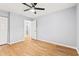 Bedroom with hardwood floors, neutral walls, closet, and doorway to other areas at 1208 River Oaks Dr. # 24-B, Myrtle Beach, SC 29579