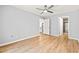 Light-filled room features hardwood floors and neutral walls leading to a bright kitchen and bathroom at 1208 River Oaks Dr. # 24-B, Myrtle Beach, SC 29579