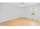Empty room features a bright window with natural light, and light hardwood style floors at 1208 River Oaks Dr. # 24-B, Myrtle Beach, SC 29579