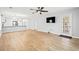 Spacious open-concept living space with light wood floors and modern ceiling fan at 1208 River Oaks Dr. # 24-B, Myrtle Beach, SC 29579
