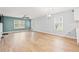 Large living room with lots of natural light, ceiling fan, and light wood floors at 1208 River Oaks Dr. # 24-B, Myrtle Beach, SC 29579