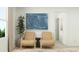 Comfortable chairs and decorative art in a well-lit living room at 1222 Willow Oaks Way, Conway, SC 29526