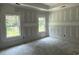 Unfinished bedroom with two windows providing natural light at 1236 Mill Banks Dr., Longs, SC 29568