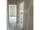 View of an unfinished home hallway leading into a room with window at 1236 Mill Banks Dr., Longs, SC 29568