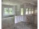 Bright and airy open-concept living space with large windows and a view at 1236 Mill Banks Dr., Longs, SC 29568