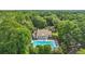 Aerial view showcasing a home's pool and lush, wooded backyard at 1259 Oatland Lake Rd., Pawleys Island, SC 29585