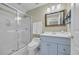 Bathroom featuring a shower with glass door and blue vanity at 1259 Oatland Lake Rd., Pawleys Island, SC 29585