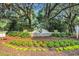 Community entrance sign reading 'Willbrook Plantation', complemented by landscaped flower beds at 1259 Oatland Lake Rd., Pawleys Island, SC 29585