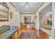 A spacious foyer offers hardwood floors, a view into other rooms, and a decorative rug at 1259 Oatland Lake Rd., Pawleys Island, SC 29585