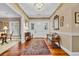 Elegant foyer features hardwood floors, chandelier, a colorful rug, and lots of natural light at 1259 Oatland Lake Rd., Pawleys Island, SC 29585