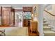 Foyer featuring decorative wood panelling, a bar area, and a stairway at 1259 Oatland Lake Rd., Pawleys Island, SC 29585