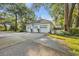 A detached three-car garage with a covered porch and ample parking space at 1259 Oatland Lake Rd., Pawleys Island, SC 29585