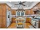 This kitchen features custom cabinets, brick backsplash, stainless steel appliances, and a butcher block island at 1259 Oatland Lake Rd., Pawleys Island, SC 29585
