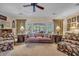 A cozy living room with upscale furniture and a view to the screened porch at 1259 Oatland Lake Rd., Pawleys Island, SC 29585