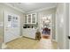 Mud room features tile floors, a built-in cabinet, and access to both the outdoors and the dining room at 1259 Oatland Lake Rd., Pawleys Island, SC 29585