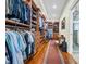 This expansive walk-in closet is complimented by wood built-ins, hardwood floors and a shower room at 1259 Oatland Lake Rd., Pawleys Island, SC 29585