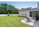 Expansive backyard featuring a playset, patio area, and well-maintained lawn at 136 Southbury Dr., Myrtle Beach, SC 29588