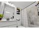 Modern bathroom with white vanity, sleek black fixtures, and a beautifully tiled shower at 136 Southbury Dr., Myrtle Beach, SC 29588