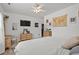 Bright primary bedroom with ample closet space, neutral color and a large wall mounted television at 136 Southbury Dr., Myrtle Beach, SC 29588