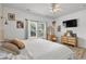 Cozy bedroom with soft bedding, natural light, and charming vanity with views from the window at 136 Southbury Dr., Myrtle Beach, SC 29588