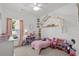 Playful bedroom with a cozy bed, decorative canopy, window and a shelf filled with toys at 136 Southbury Dr., Myrtle Beach, SC 29588