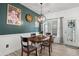 Dining area featuring a round wood table, chair accents, decorative chandelier, and large wall decor at 136 Southbury Dr., Myrtle Beach, SC 29588