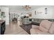 Open concept living room with ample seating, hardwood floors and view into dining area and kitchen at 136 Southbury Dr., Myrtle Beach, SC 29588