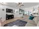 Spacious living room featuring modern decor, wood flooring, with a view into the dining and kitchen areas at 136 Southbury Dr., Myrtle Beach, SC 29588