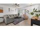 Bright living room with neutral paint, wood floors, a comfortable gray sofa and a pink recliner at 136 Southbury Dr., Myrtle Beach, SC 29588