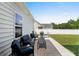 Stylish patio with comfortable seating and a view of the backyard and fence at 136 Southbury Dr., Myrtle Beach, SC 29588