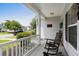Cozy front porch featuring a rocking chair and a view of the serene neighborhood street at 136 Southbury Dr., Myrtle Beach, SC 29588