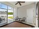 Cozy screened porch with outdoor seating, ceiling fan, and view of the backyard at 136 Southbury Dr., Myrtle Beach, SC 29588