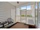 Relaxing screened-in porch with furniture, outdoor view and access to backyard at 136 Southbury Dr., Myrtle Beach, SC 29588