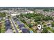 An aerial view of a community near shopping centers, lush trees, and a mix of residential homes at 1468 Fox Hollow Way, North Myrtle Beach, SC 29582