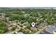 Expansive aerial view of a residential community nestled amidst lush greenery and mature trees at 1468 Fox Hollow Way, North Myrtle Beach, SC 29582