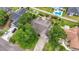 Bird's-eye view of a landscaped property with a long driveway, mature trees, and well-maintained roof at 1468 Fox Hollow Way, North Myrtle Beach, SC 29582